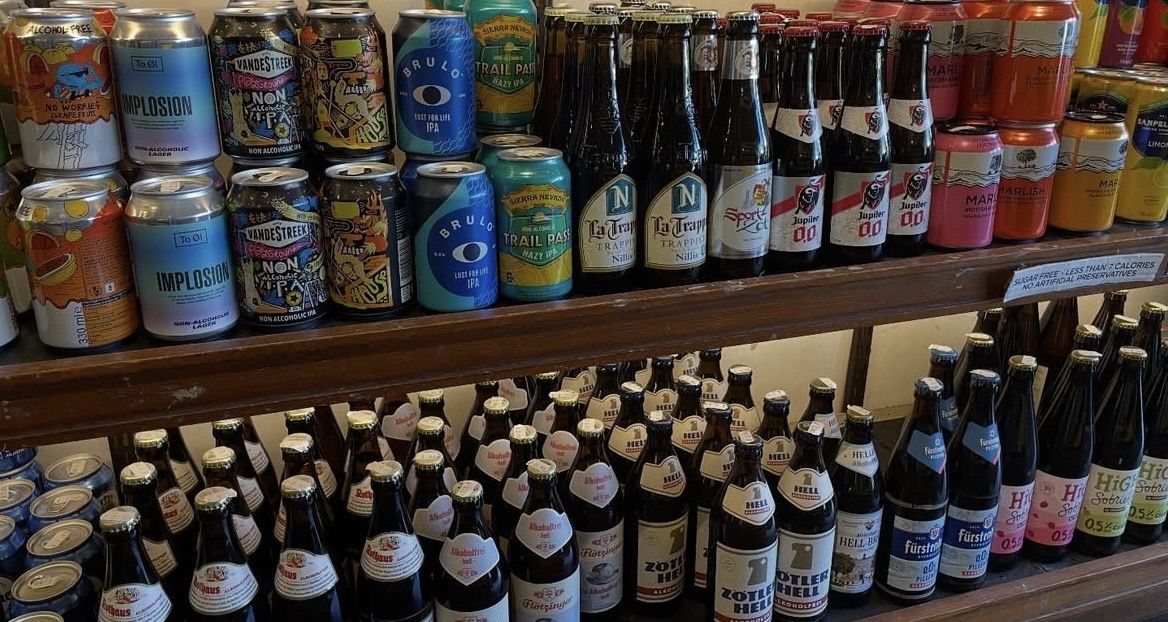 Second shelf with Schöfferhofer watermelon mint, Bitburger radler, Cloudwater Fresh and LESS, Mash Gang, Rothaus and Krombacher alcohol-free bottles